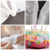 Close-up photos showing stainless steel safety pins in various sizes and styles