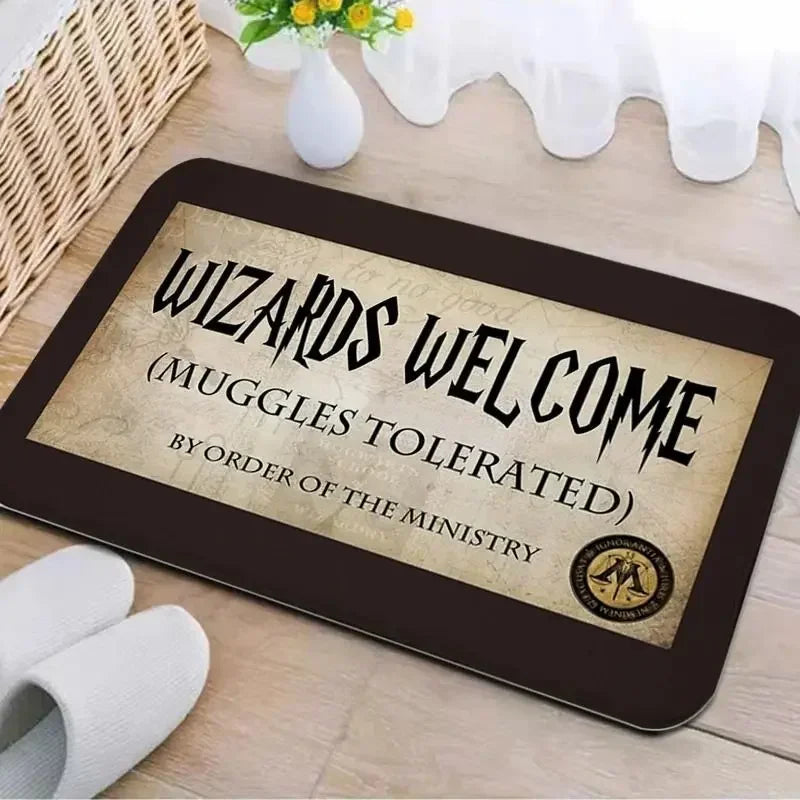 A dark brown entrance mat with carved text that reads Wizards Welcome Muggles Tolerated by Order of the Ministry