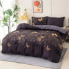 A dark purple duvet cover set featuring a gold butterfly print on a bed with a large green plant.
