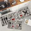 A rustic kitchen mat featuring a heart design with knife and fork icons on a distressed wooden background.