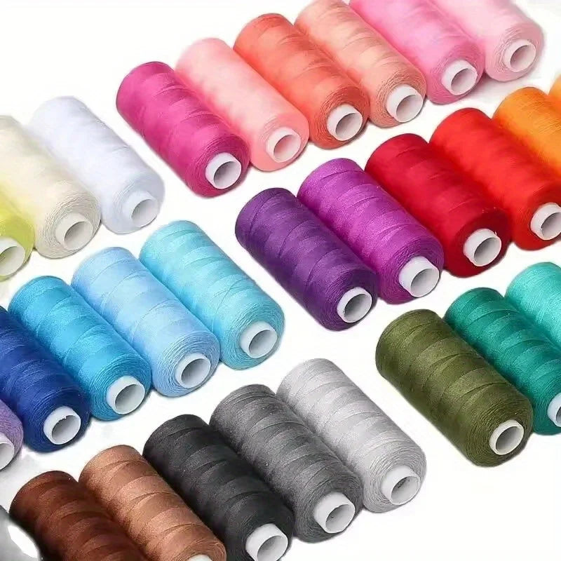 A collection of 12 rolls of mixed-color polyester sewing thread in various shades of pink, orange, red, purple, and green.