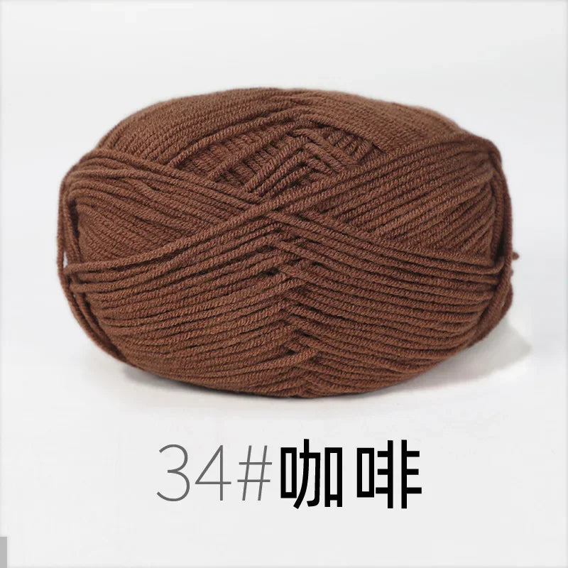 A ball of dark brown organic cotton 4ply knitting yarn for crafts.