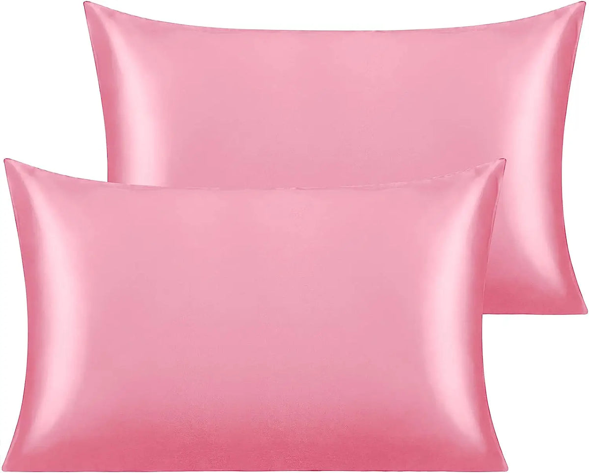 A pink silky satin toddler pillowcase set featuring two rectangular pillows.