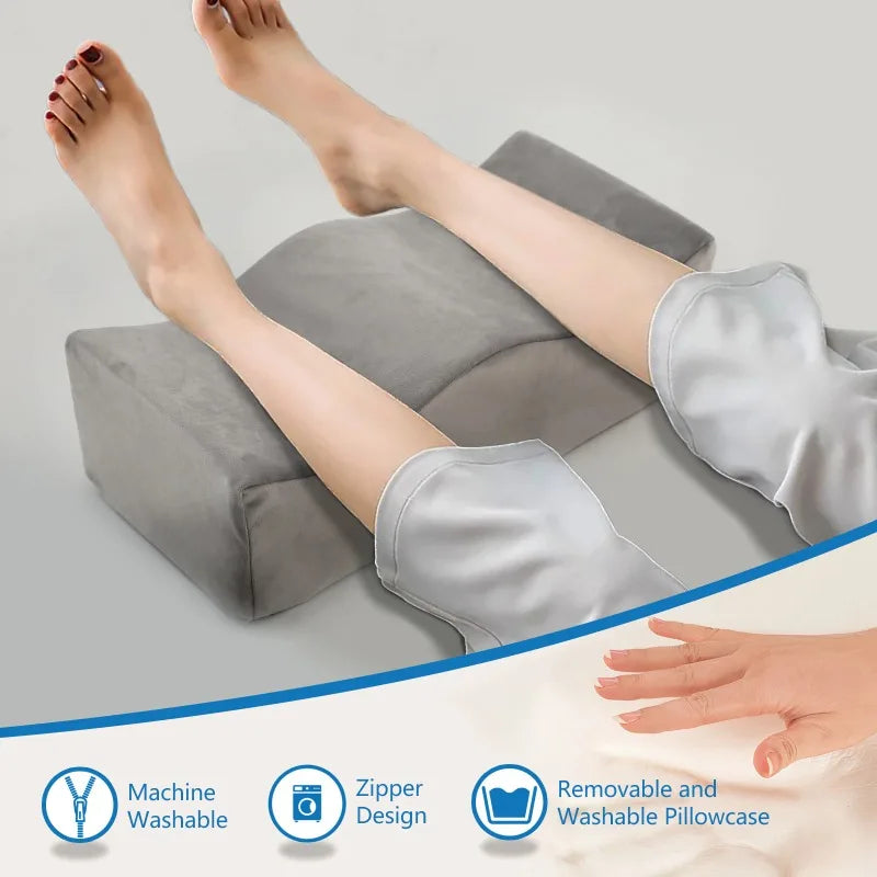 A person's legs are supported by a gray memory foam pillowcase designed for ergonomic leg support.
