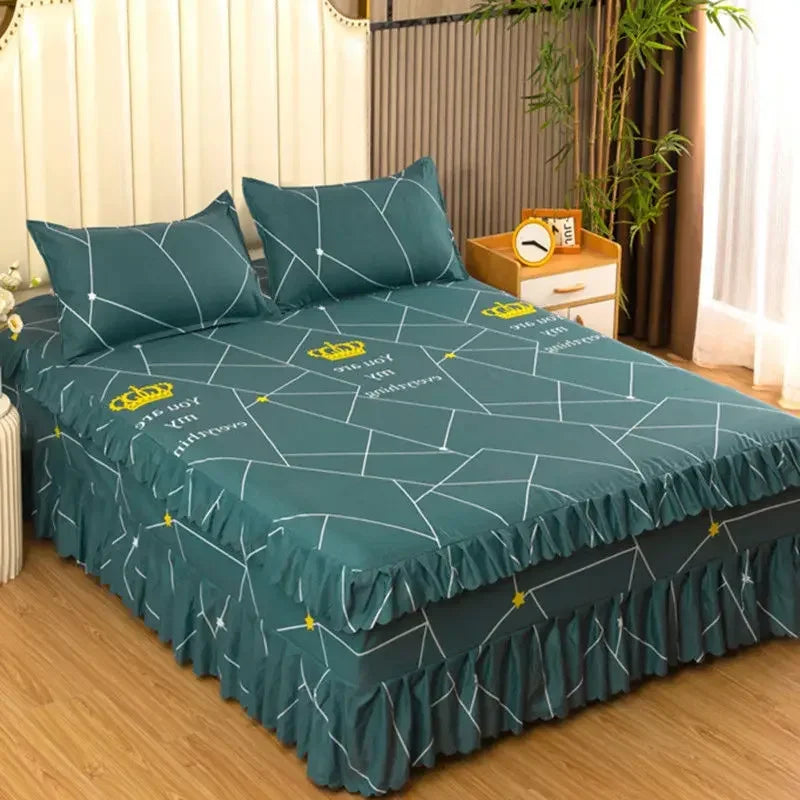A set of three teal fitted bed sheets with a geometric pattern and elastic lace trim on a bed.