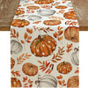 Linen table runner featuring an orange and white pumpkin pattern for autumn decor