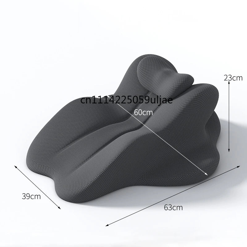 Gray ergonomic memory foam reading pillow showing its shape and dimensions.