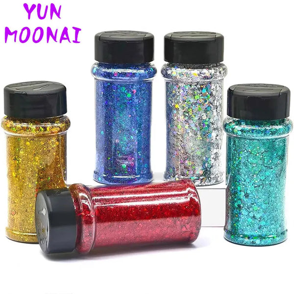 A collection of colorful nail glitter mixes in glass jars and a tube, featuring iridescent and holographic shades.