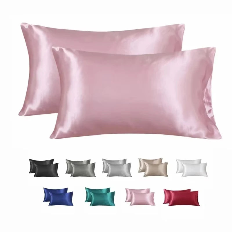 A collection of satin silk pillow covers in various shades including pink, gray, beige, blue, green, and red.