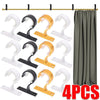 Four multi-style curtain rod brackets in white and yellow for wall mounting.