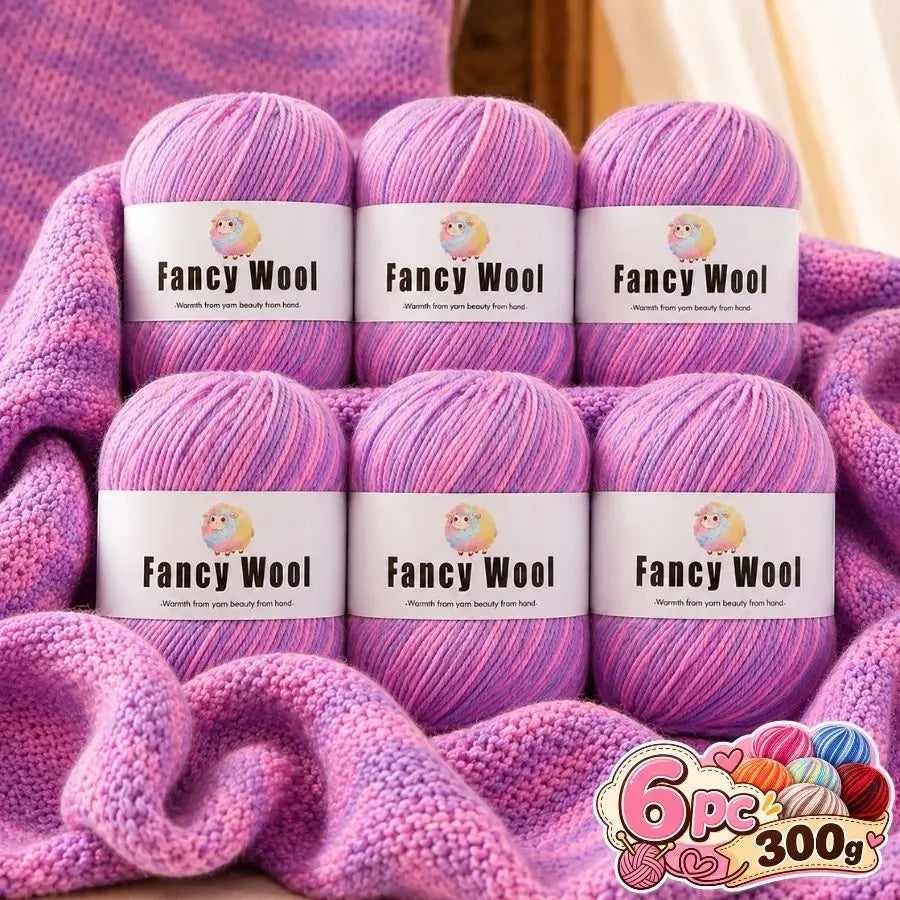 A set of six purple and pink gradient alpaca wool yarns packaged in cardboard boxes.