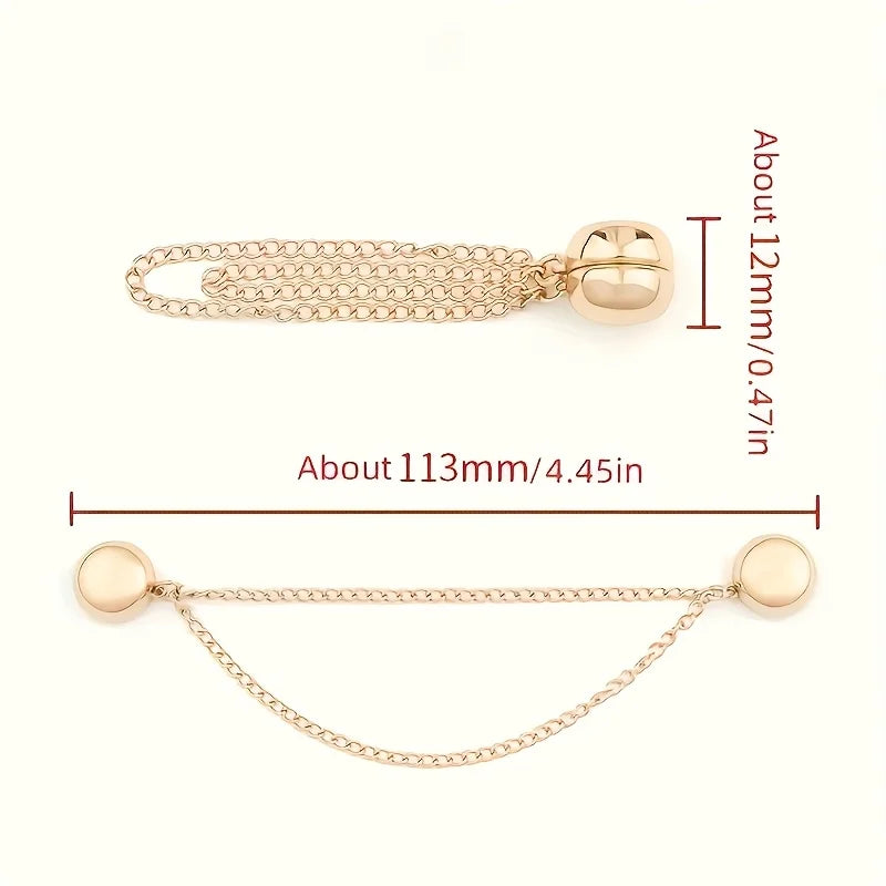 Gold-toned magnetic clothing adjustment buttons with a chain and a flat bar.
