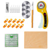 A set of a 45mm rotary cutter, cutting mat, and craft accessories including various blades and a grid cutting surface.