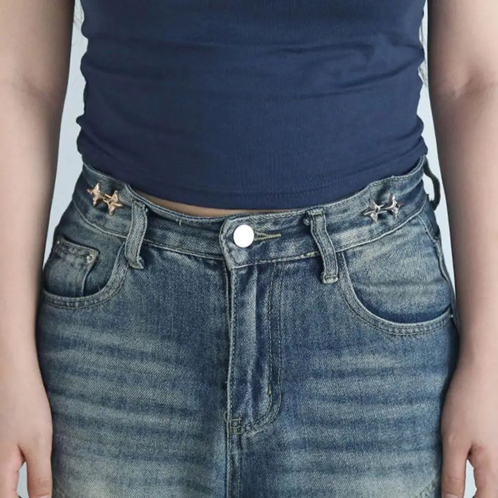 Close-up of a pair of blue denim jeans with decorative stitching and an adjustable waist tightening buckle.