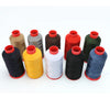 A collection of heavy duty nylon sewing thread spools in various colors including beige, gray, red, green, and black.