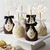 A display of satin ribbon twist tie bows in black and white on a white platter.