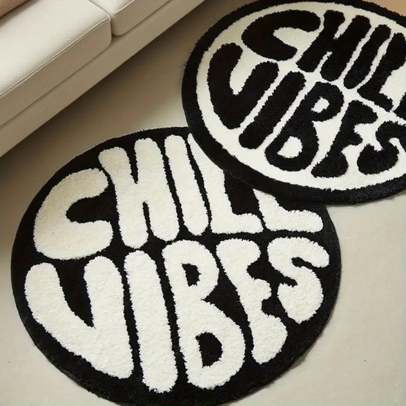Black and white felt rug with the text CHILIBES in a distressed font