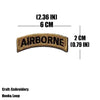 A tan embroidered patch with the word AIRBORNE and dimensions of 2.36 inches by 6 cm.