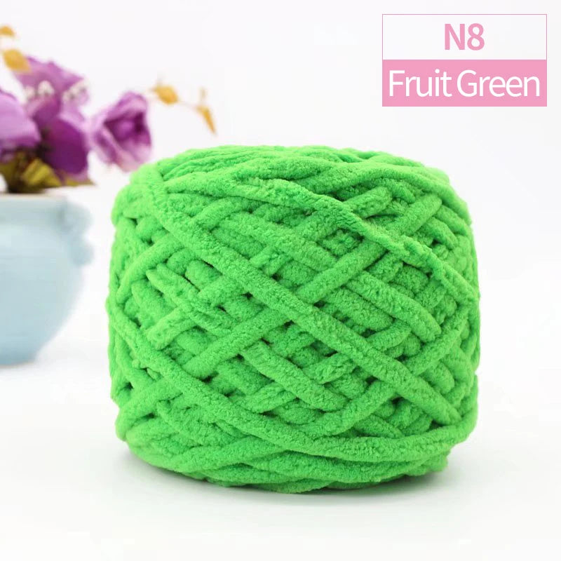 A ball of bright green chunky velvet knitting yarn labeled N8 Fruit Green.