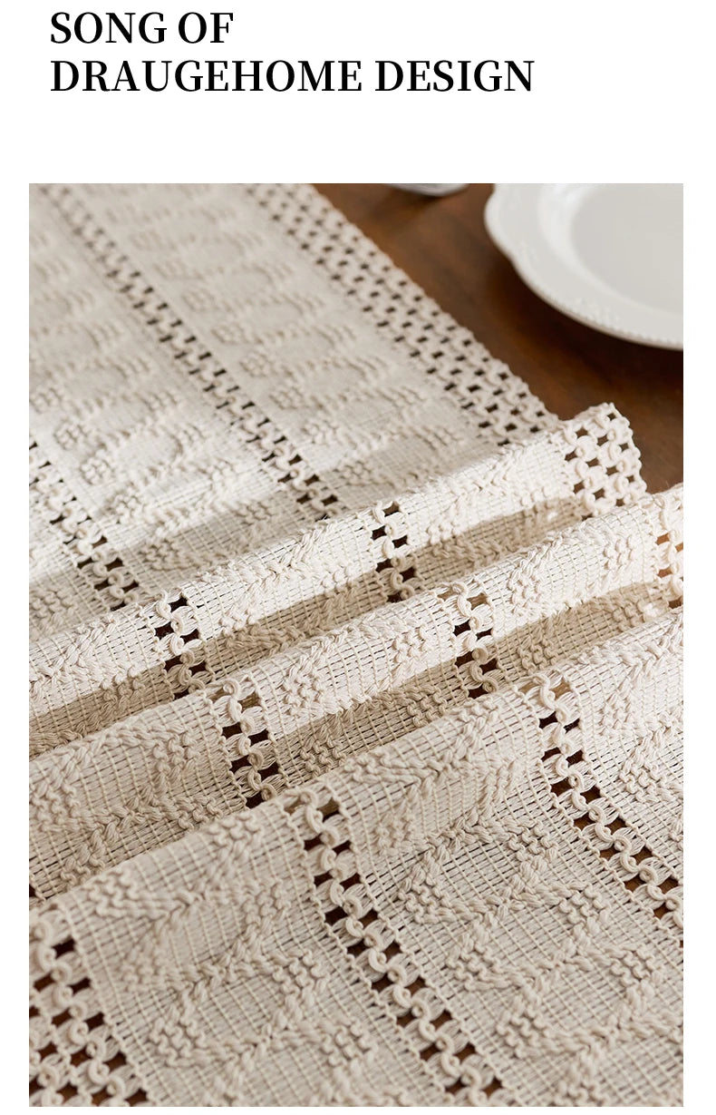 Beige boho hand-woven table runner featuring intricate lace patterns on a wooden surface.