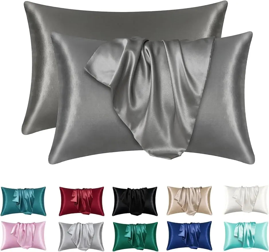 A set of satin silk pillow covers in various shades of gray and blue for hair and beauty.