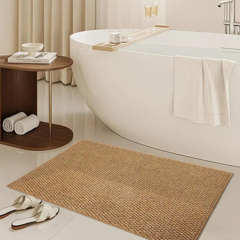 A woven natural sisal jute rug placed on a light floor next to a modern bathroom vanity.