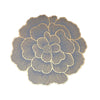 Gold plated peony flower design on a round coaster with fine line texture.