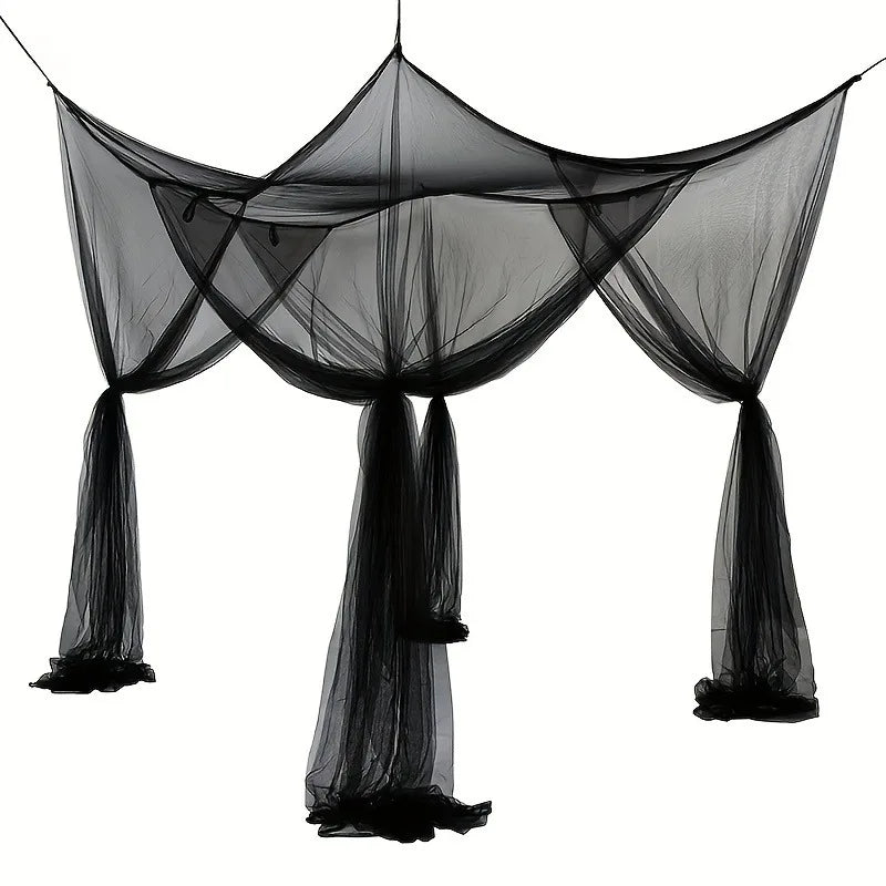 Black floor-to-ceiling mosquito net curtain draped over a frame.