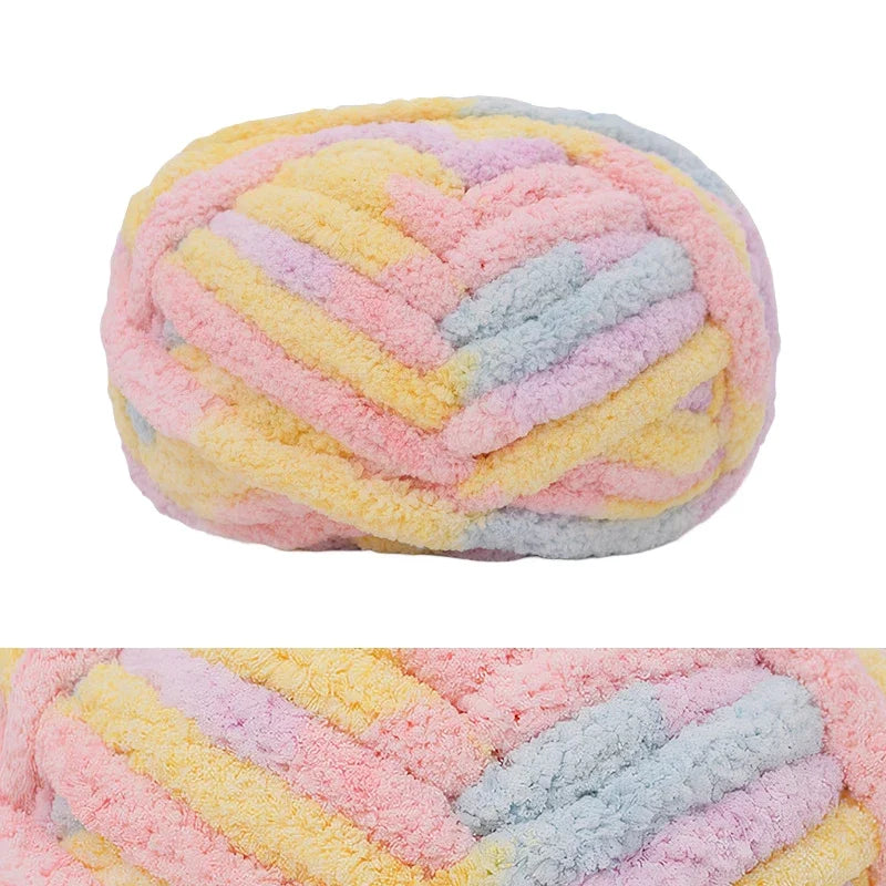 A ball of hand-knitted wool finger line scarf featuring pastel pink, yellow, and blue colors.