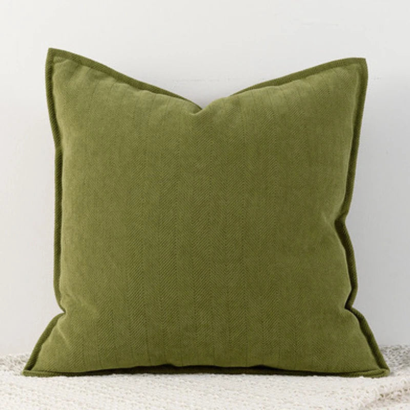 Solid olive green chenille throw pillow cover with a subtle vertical stripe texture.