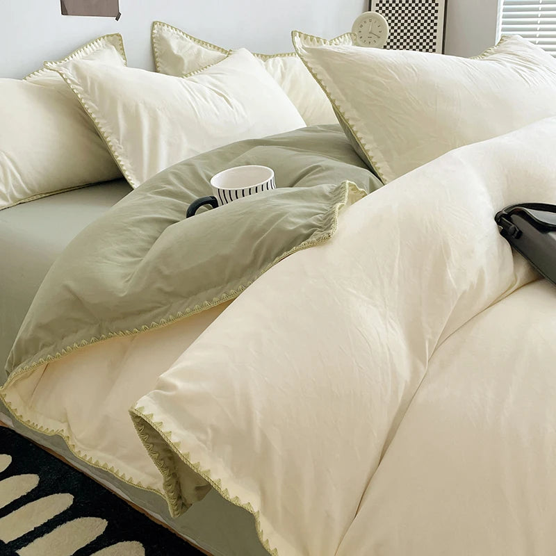 A close-up of a luxurious beige washed cotton bed linen set featuring pillows and a duvet on a bed.
