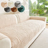 A beige textured sofa cushion displayed with various fabric swatches and natural light in a bright room.