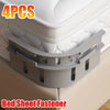 Four non-slip bed sheet fasteners in gray are shown securing a mattress cover.