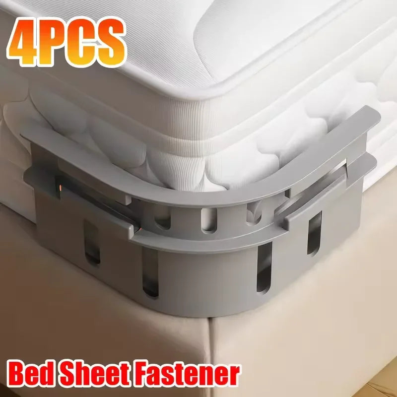 Four non-slip bed sheet fasteners in gray are shown securing a mattress cover.