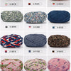 A collection of hand-dyed fabric strip yarn in various colors and patterns for crochet and knitting projects.
