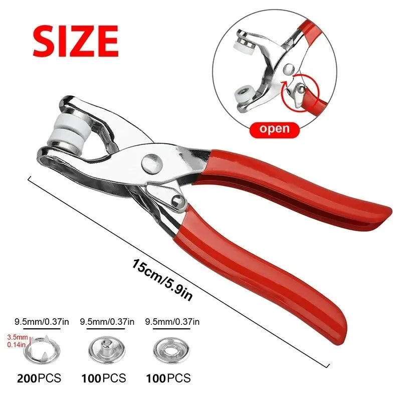 A pair of silver metal prong rings and snap buttons used as DIY sewing tools with red handles.