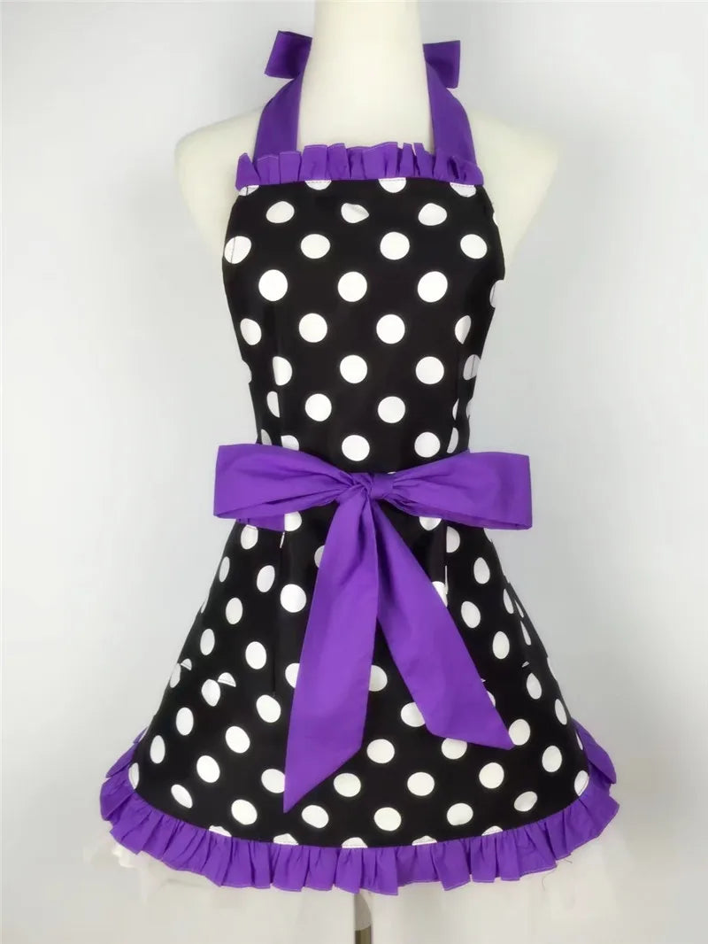Purple and black polka dot ruffle apron with ties displayed on a mannequin.