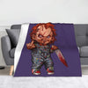 A purple graphic featuring Chucky from the horror movie, displayed on a gray sofa.