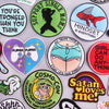 A collection of embroidered letter iron-on patches featuring various sayings and designs on a light gray background.