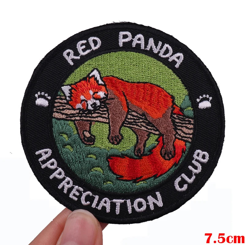 A black embroidered patch featuring a red panda illustration with text reading Red Panda Appreciation Club.