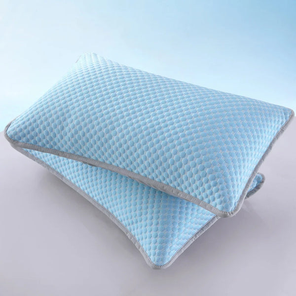 Light blue quilted bean pillow cover folded and displayed on a white surface.