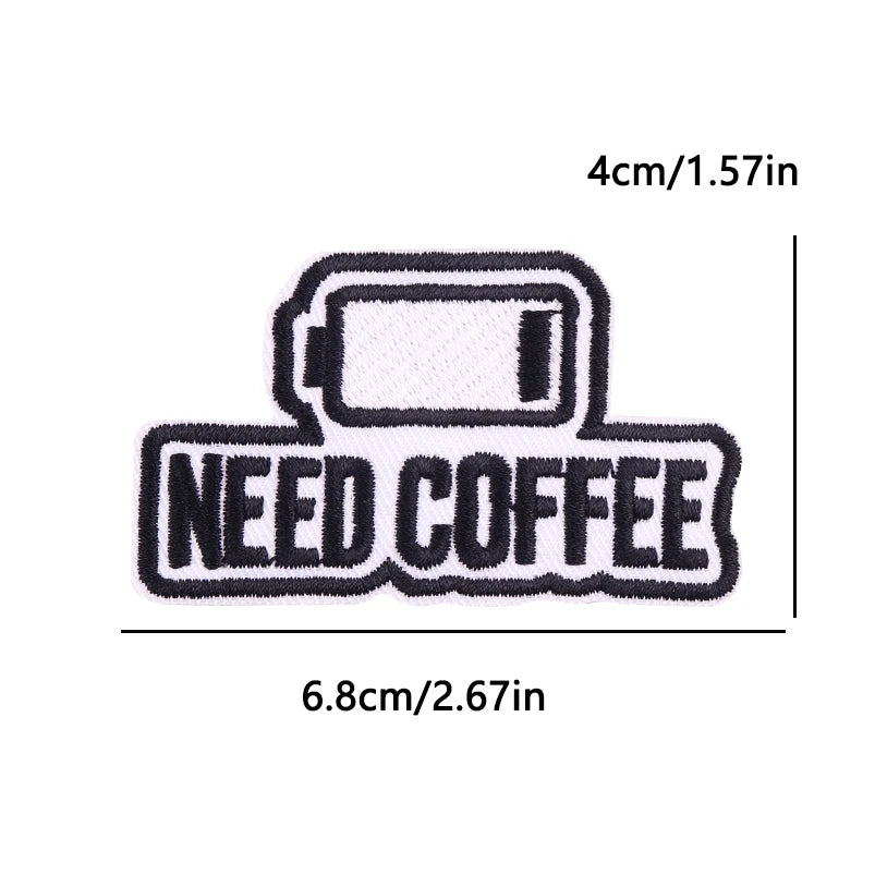 Black embroidery patch with the text NEED COFFEE and a rectangular design.