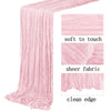 Pink boho gauze table runner showing soft texture, sheer fabric, and clean edge detail.