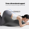 A woman is lying down, using a three-dimensional support garment for back and leg relaxation.