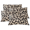 A set of two leopard print decorative pillow covers in black and beige spots.