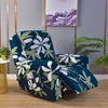 A deep teal floral print recliner and sofa slipcover set displayed in a modern room.