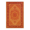 An orange and rust colored area rug with intricate geometric patterns in a bohemian Turkish style.