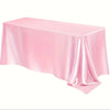 A smooth pink satin tablecloth draped on a table.