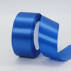 A roll of bright blue satin craft ribbon shown from the side.