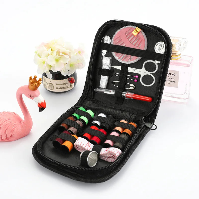 A black zippered pouch containing a complete sewing kit for handicrafts and embroidery, including scissors, needles, and thre